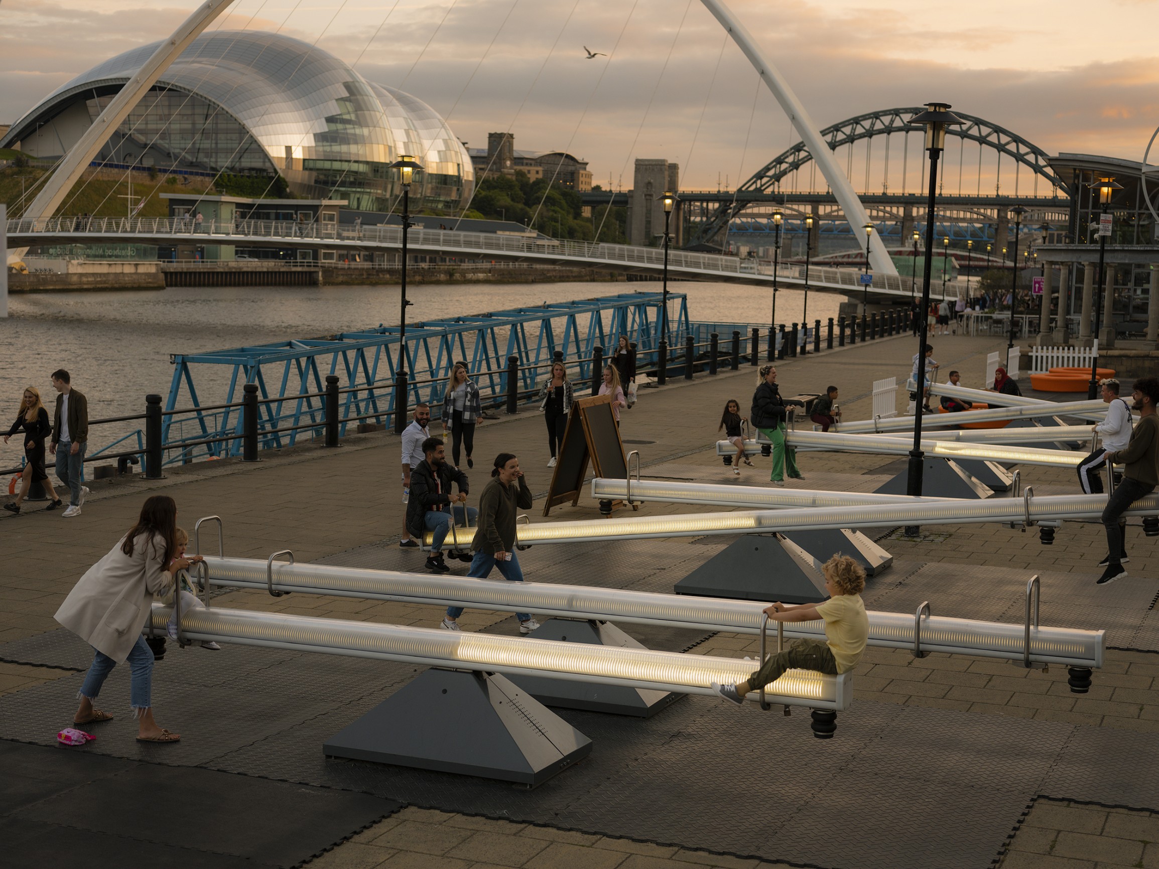 Giant see-saws on the river Tyne with bridges in background