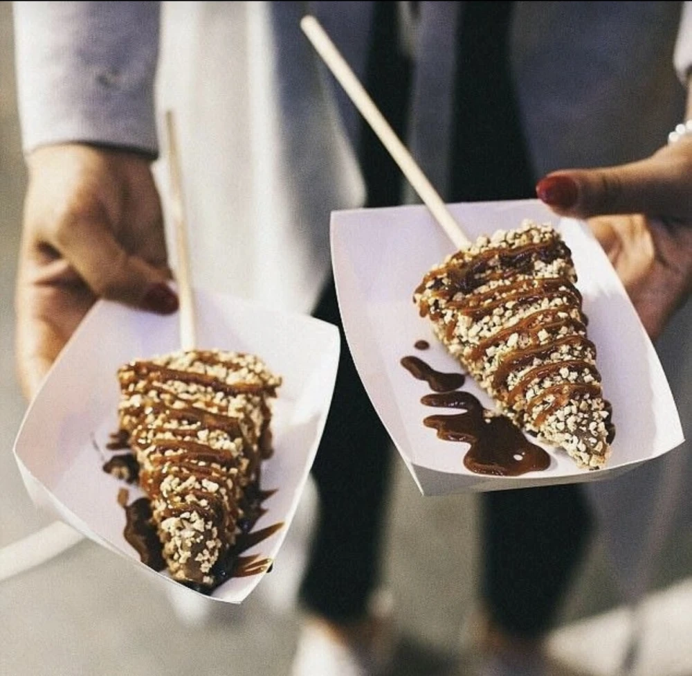 Teesside Live | Nov 2025 | North East Christmas Market's viral £8 cheesecake-on-a-stick needs two to tackle it