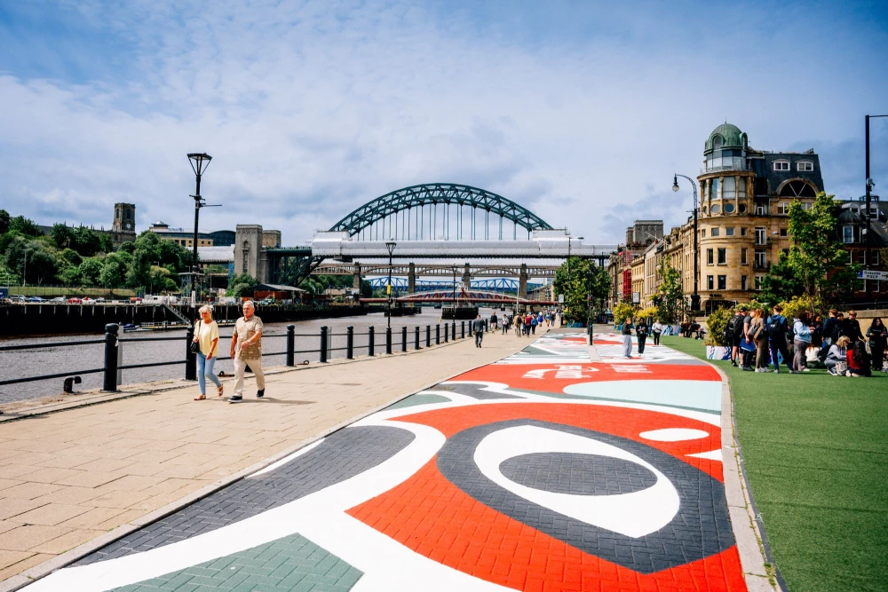 Hits Radio | Jun 2026 | Newcastle artist reveals mural designed for 45th Great North Run